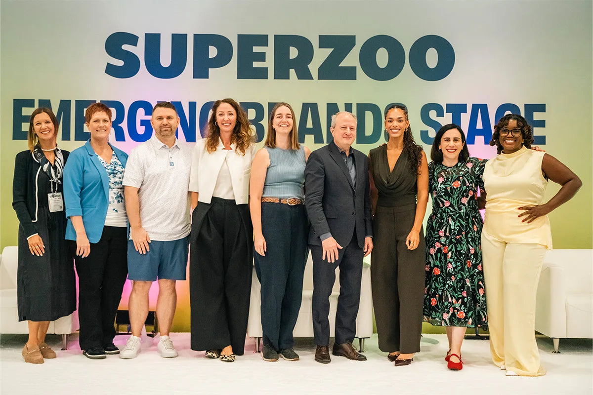 A group gathered on the Emerging Brands Stage after the 2026 Next Wave Pitch Competition at SUPERZOO.